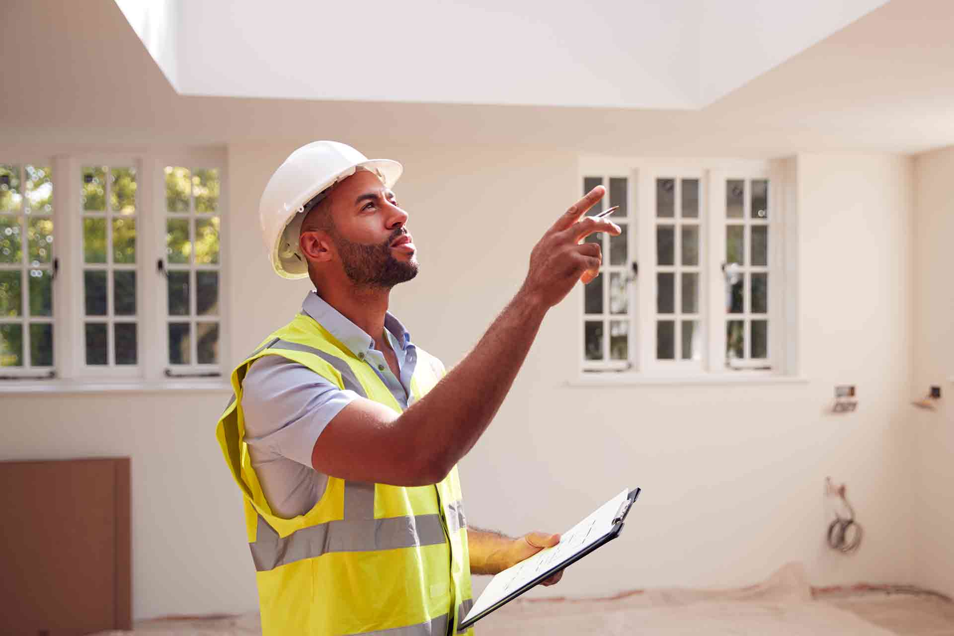 Third Party Wall Surveyors Middlesbrough reviewing plans between two parties during a dispute
